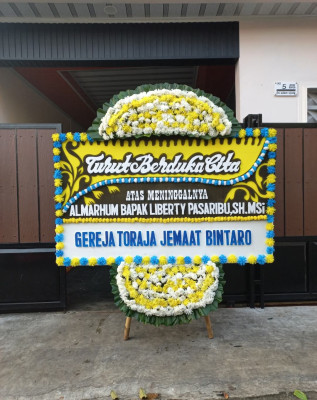 Papan Bunga Duka di Mauk Barat